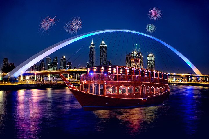 Savor an unforgettable evening cruising Dubai Canal enjoying a delicious international buffet dinner against a stunning city skyline with the added joy of fireworks illuminating the night.